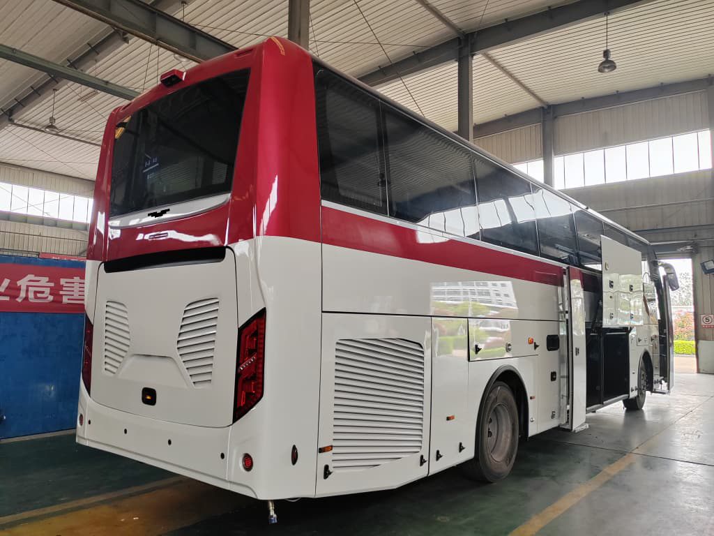 Rear-right with passenger door and luggage bay open