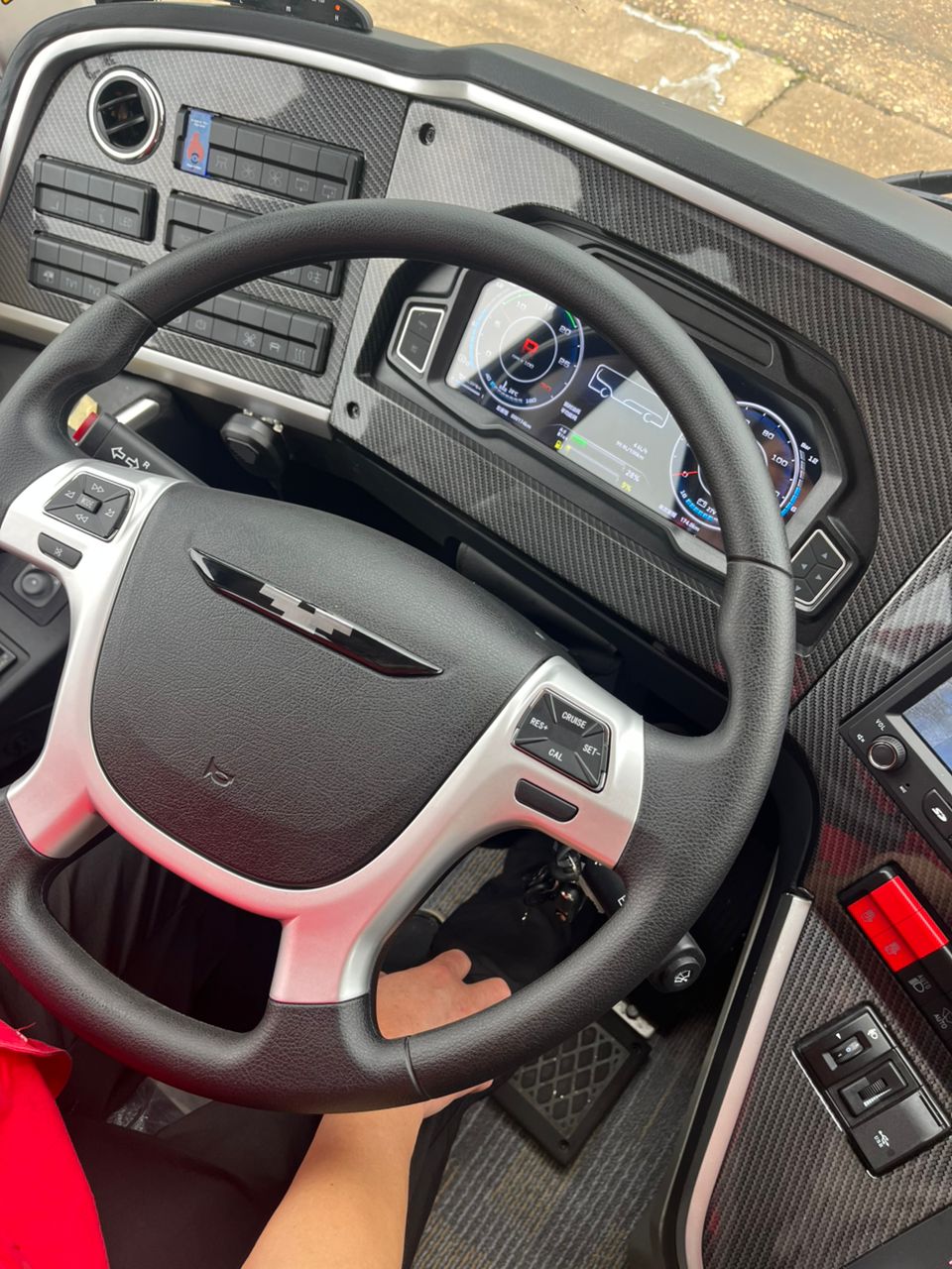 Modern bus driver cockpit with carbon-fiber dash and digital gauges